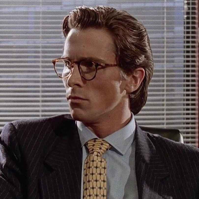 Chic ties making a bold statement, completing the sophisticated look inspired by Patrick Bateman costume from American Psycho.